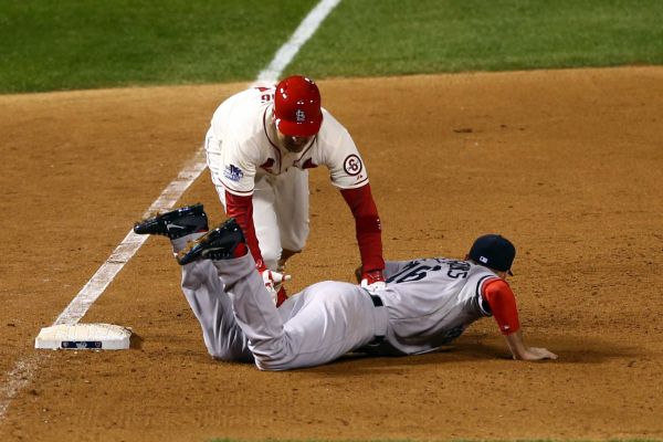 Allen Craig trips over Will Middlebrooks' legs for a walk-off obstruction call. Media by www.newsday.com