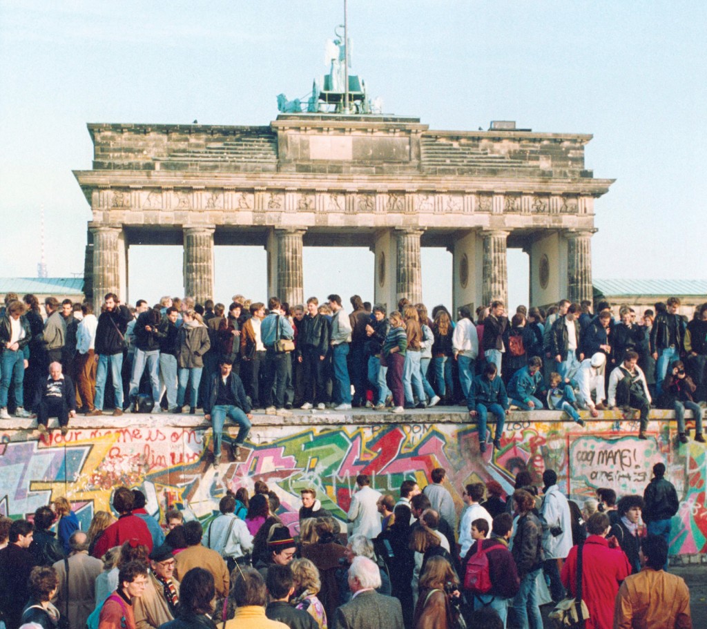People gathering around Berlin Wall when it fell on Nov. 9th, 1989. Source: www.britannica.com