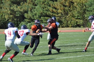 Sam Northey takes the hand off for Greenville.  Photo by Greenville College Football.