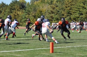 Lincoln Johnson (7) and Robert Deering (56) look to get the tackle.  Photo by Greenville College Football.