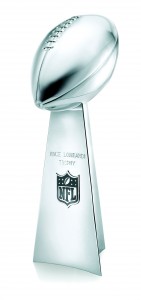 Annual winner of the SuperBowl Game receives the Lombardi Trophy. The Superbowl trophy is named after Vince Lombardi. As a Head Coach brought the Green Bay Packers  to five Superbowls.