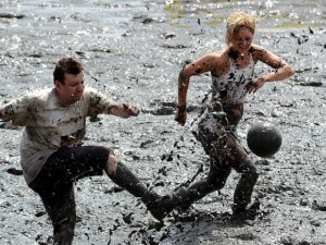 Soccer being played at the Mud Olympics, Image from telegraph.co.uk