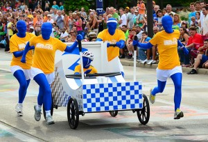A team of bed racers coming to the finish. From customink.com
