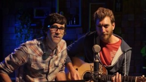 Rhett and Link with a guitar.