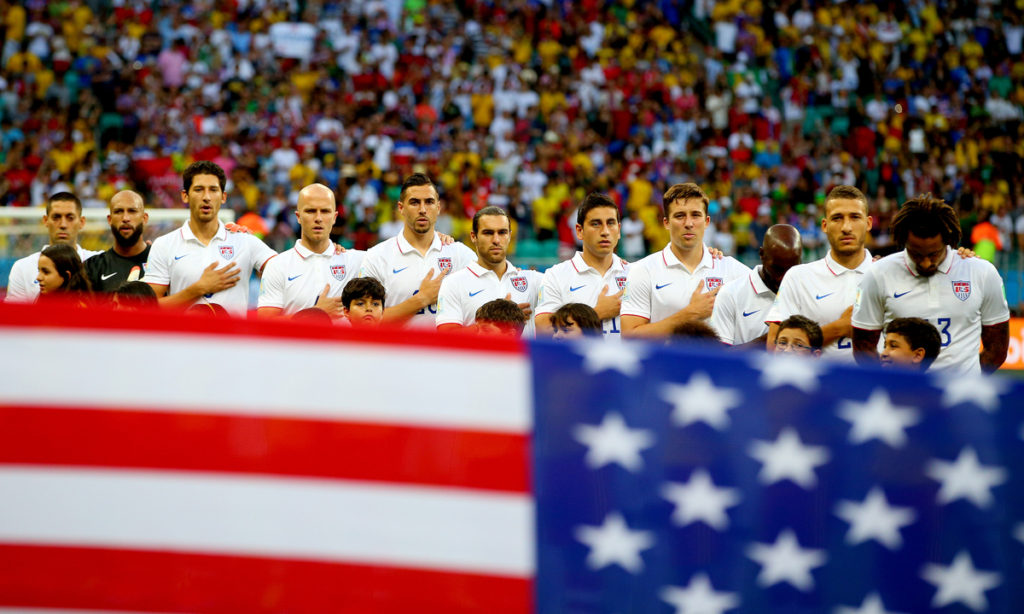 The USA starting XI sing their national anthem